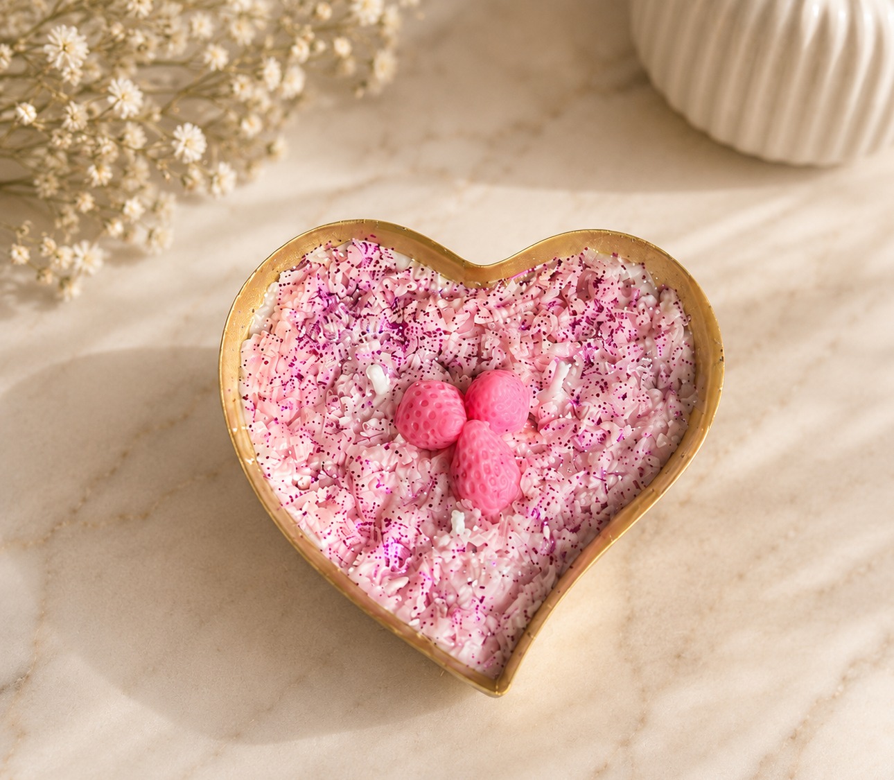 Strawberry Bliss Heart Candle – pink wax shavings with strawberry accents in gold-edged tray, by Lumina By Saima