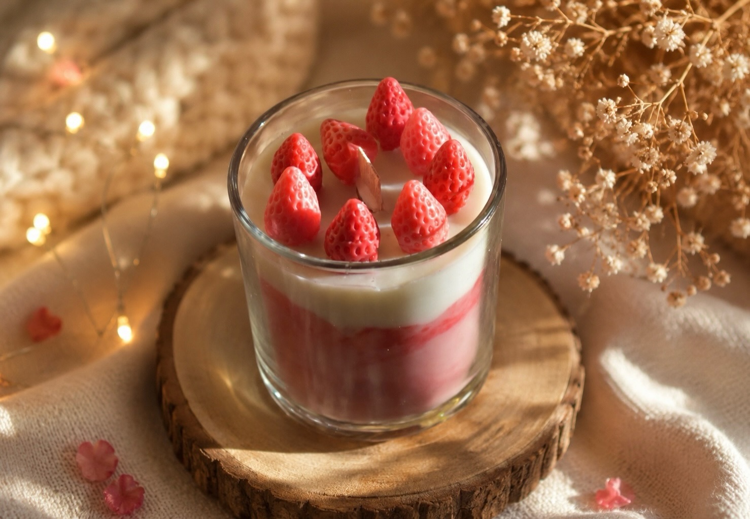 Strawberry Cream Delight – dessert-inspired candle with pink swirls and mini strawberries, by Lumina By Saima
